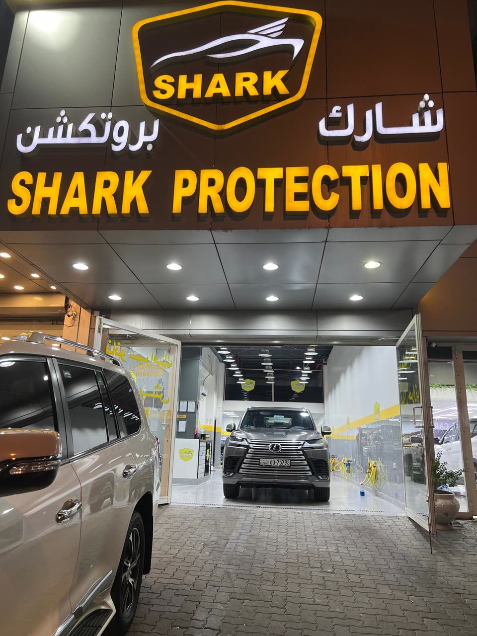 Lexus LX at the Shark Protection KW storefront at night